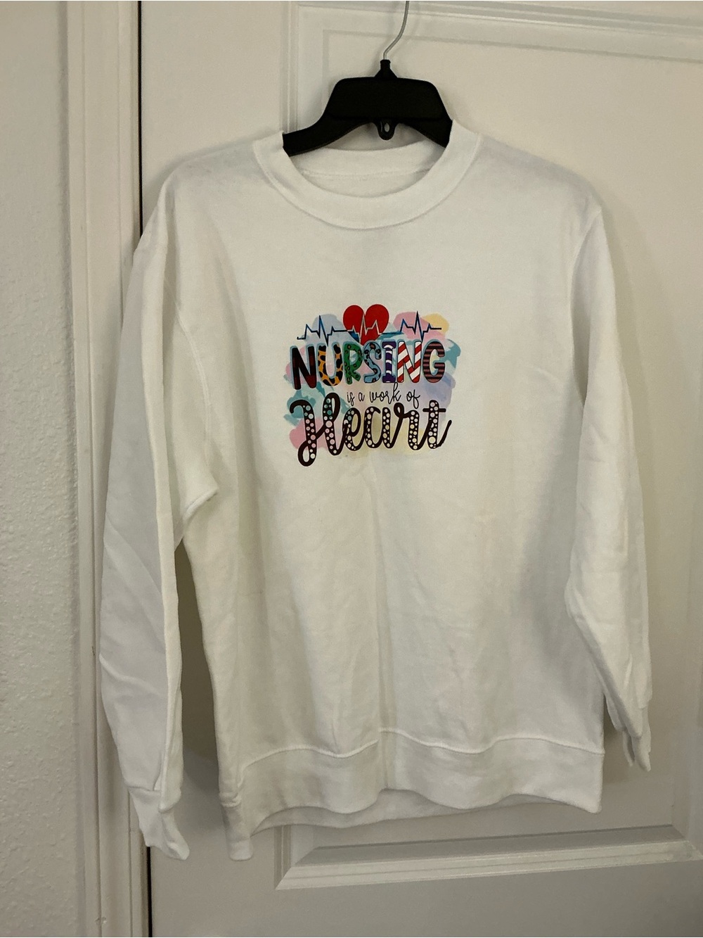 NWOT Nursing Is A Work Of Heart White Graphic Crewneck Sweatshirt Size M